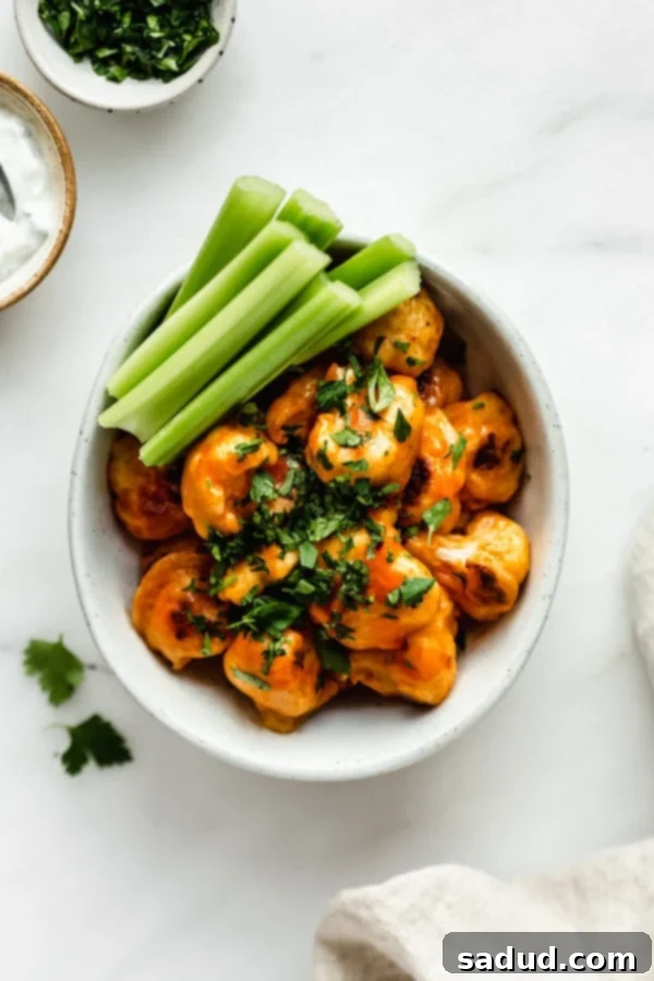 15 Vegetarian Dishes You'll Adore 17 overhead image of buffalo cauliflower bites with celery.