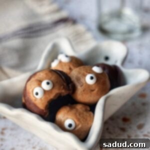 Wicked Wholesome Vegan Halloween Recipes 5 Delicious Vegan Buckeyes with a chocolate coating and peanut butter center.