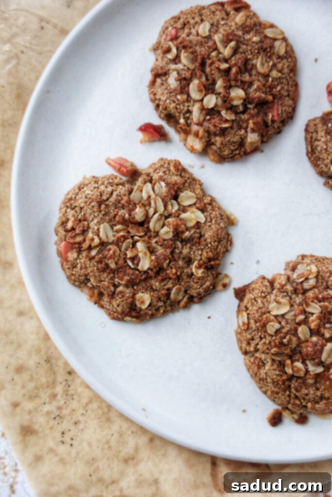 A plate of apple crisp cookies, showing the rustic streusel topping before glazing.