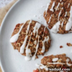 A plate of apple crisp cookies with glaze, beautifully arranged and ready to be enjoyed.