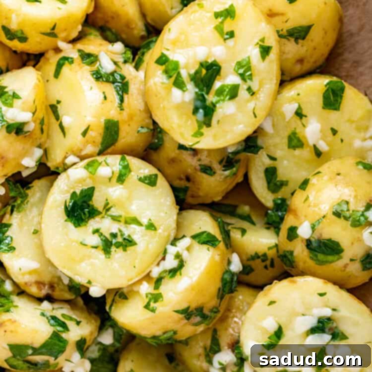 Close-up image of garlic butter parsley potatoes.