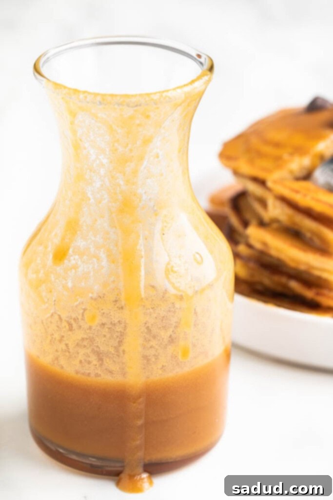 A bowl of creamy peanut butter maple syrup, ready to be served