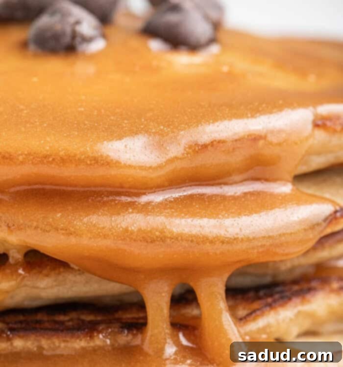 Homemade Peanut Butter Maple Syrup drizzled over pancakes