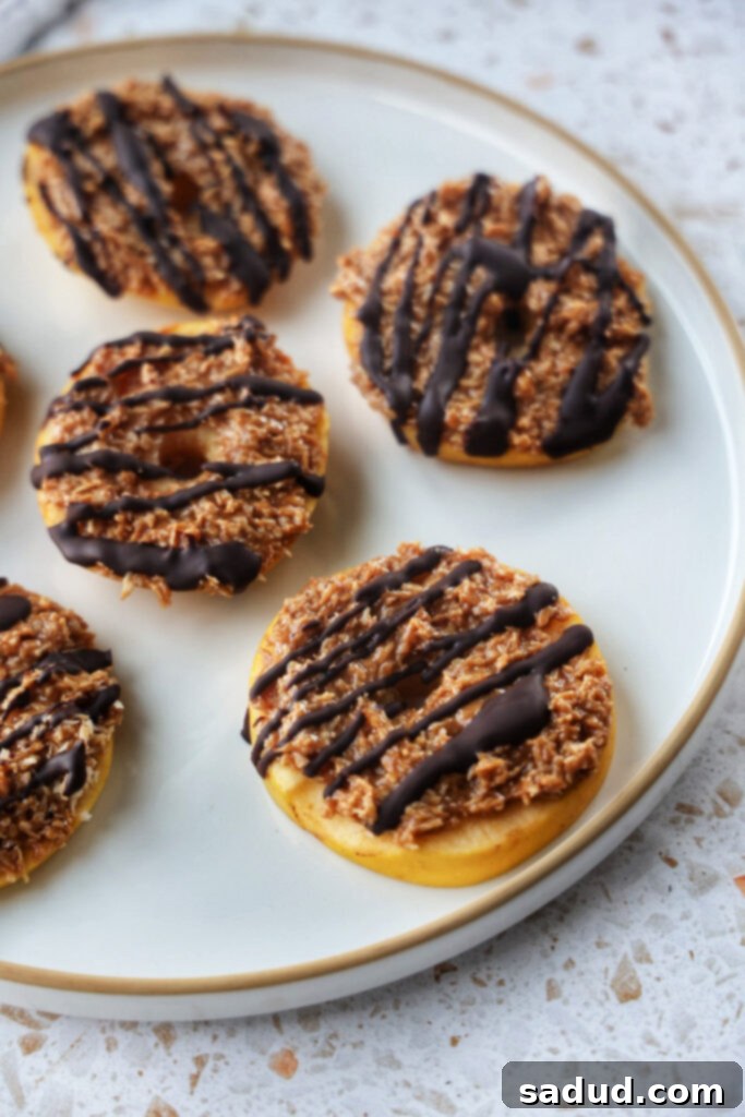Samoa Apple Slices: Fresh apple rounds topped with a sticky coconut caramel and chocolate drizzle