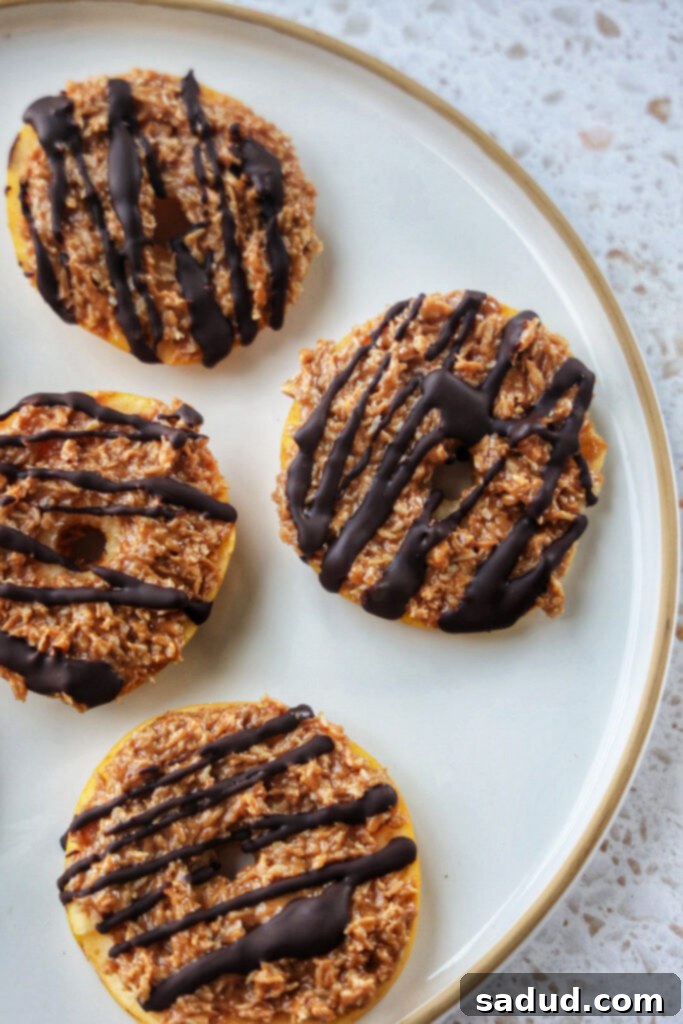 Apple rounds covered in a samoa caramel coconut mixture and drizzled with chocolate.