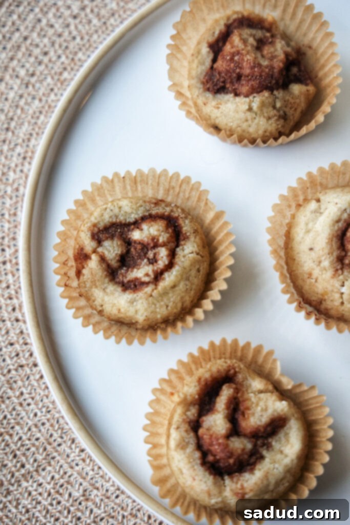 A plate of unfrosted banana cinnamon rolls.