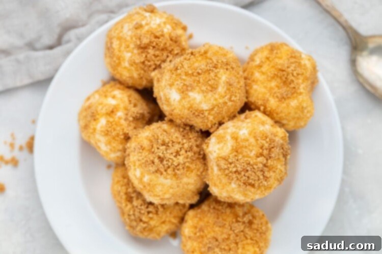 A mountain of delicious cream cheese fat bombs on a white plate, firm and ready to eat