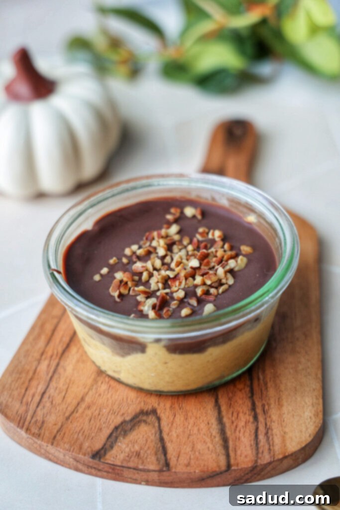 A pumpkin magic shell yogurt cup, freshly prepared and ready to chill.