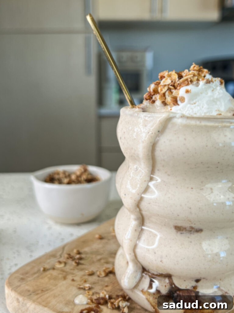 A close up shot highlighting the creamy texture and inviting layers of the apple crisp smoothie.