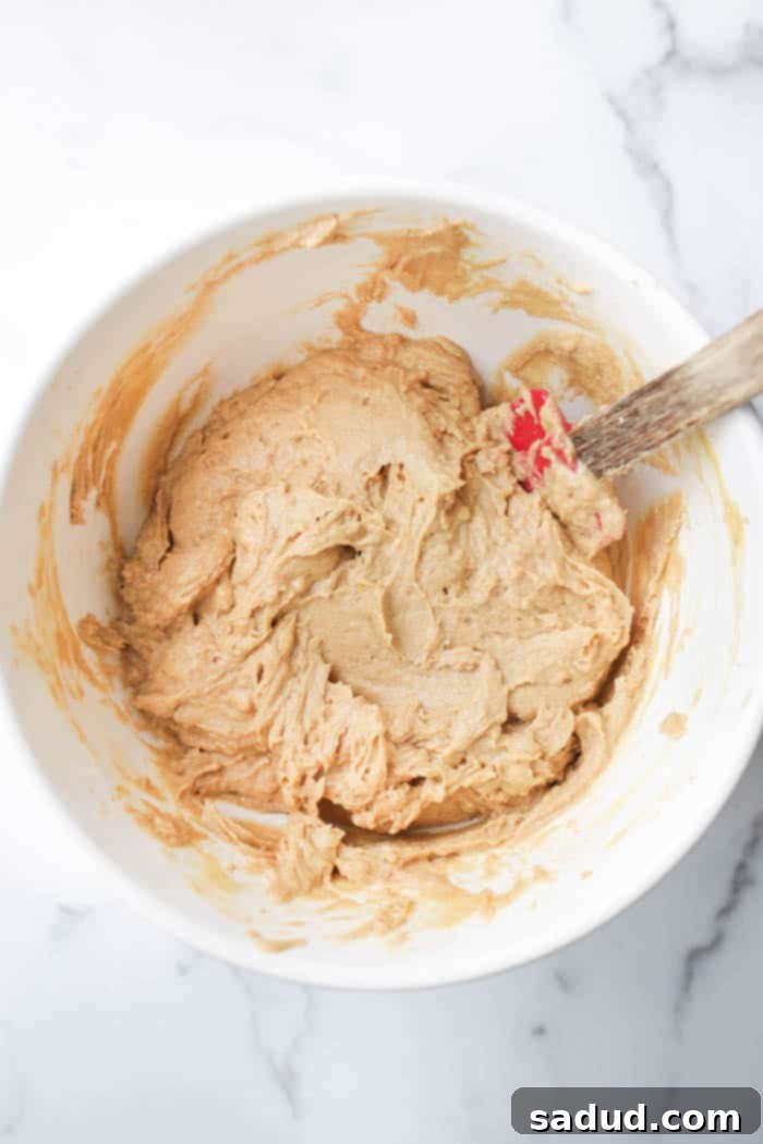 Combining wet and dry ingredients for lemon muffins