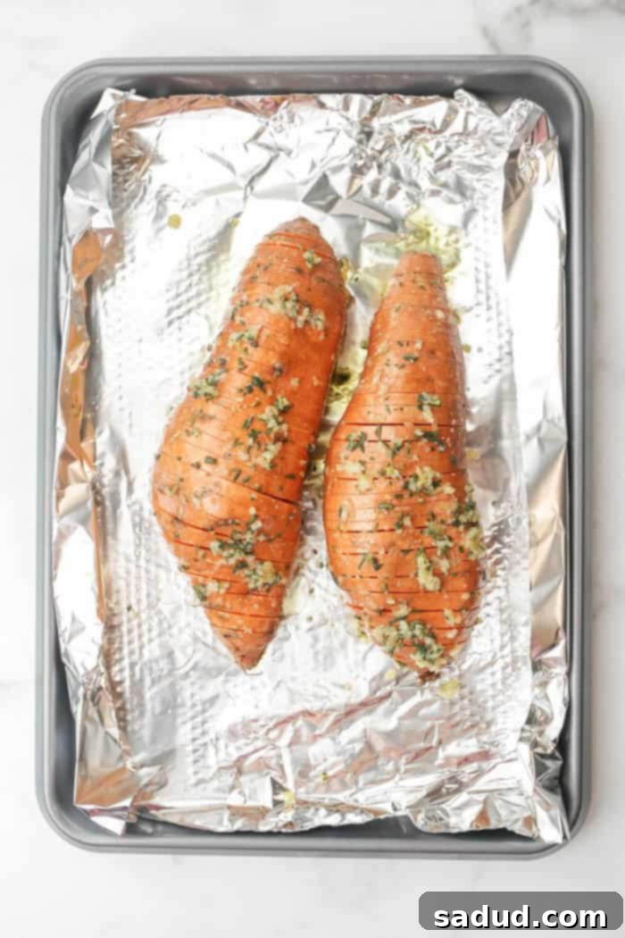 Baked hasselback sweet potatoes on a baking sheet