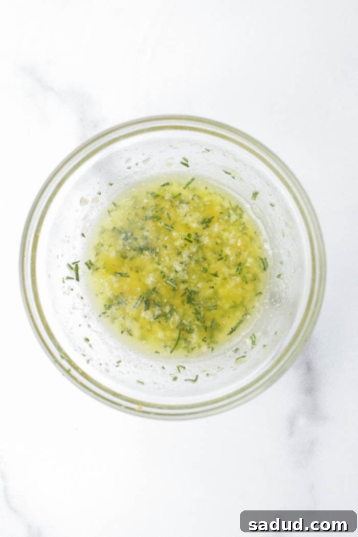 Preparing the herb and butter mixture for hasselback sweet potatoes