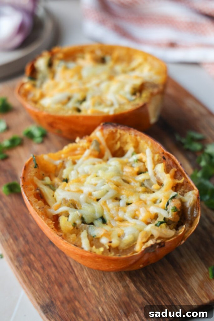 French onion spaghetti squash boats, beautifully plated and ready to eat with golden melted cheese and fresh parsley.