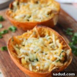 Finished French Onion Spaghetti Squash Boats, a healthy and delicious meal, topped with melted cheese and fresh herbs.