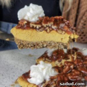 A slice of caramel pecan cheesecake on a plate