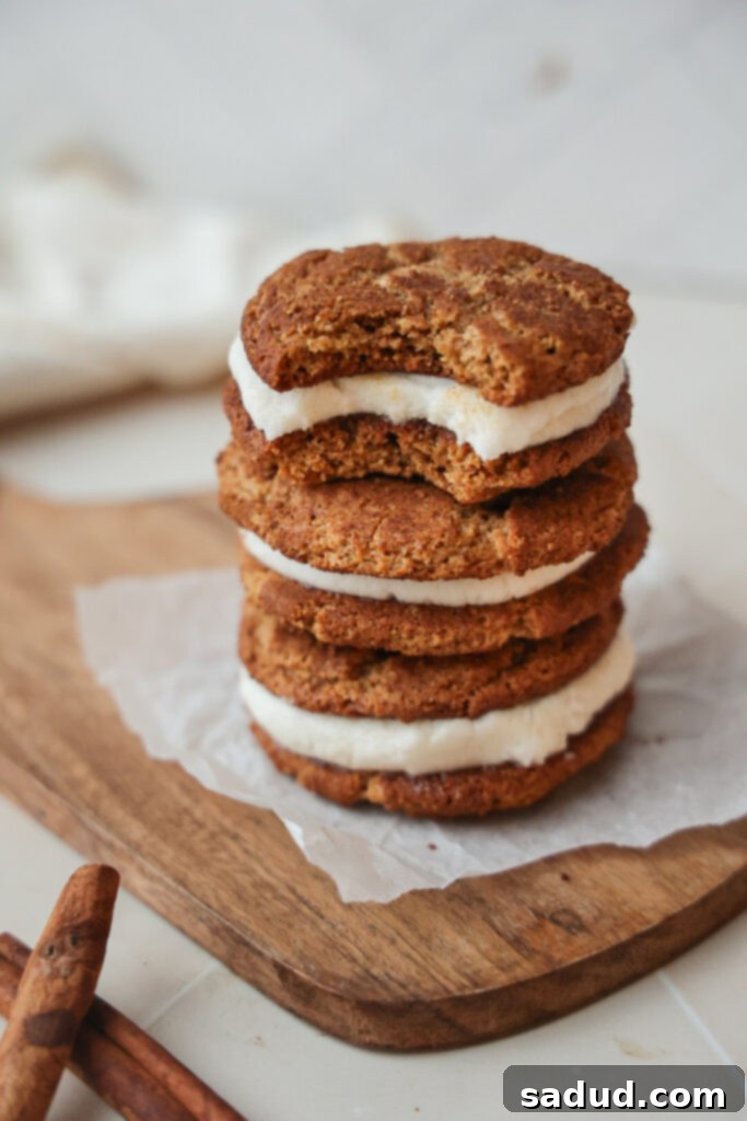 Paleo Gluten Free Snickerdoodle Creme Pies 4 A snickerdoodle creme pie with a bite taken out, showing the soft cookie and creamy filling.