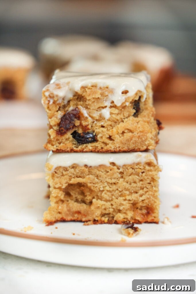A stack of perfectly baked cranberry orange bars, showcasing their moist texture and a hint of orange glaze.