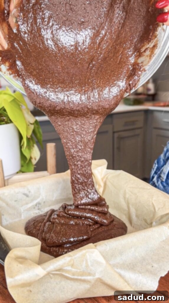 Close-up of a stack of Fudgy Almond Flour Mint Brownies, showcasing their rich, dense texture and optional toppings.