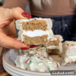 A finished healthier Little Debbie's Christmas Tree Cake, showcasing its vibrant green frosting, white chocolate shell, and festive sprinkles.