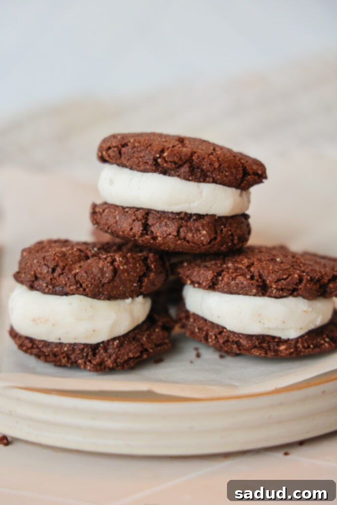 A plate of chocolate sandwich cookies.