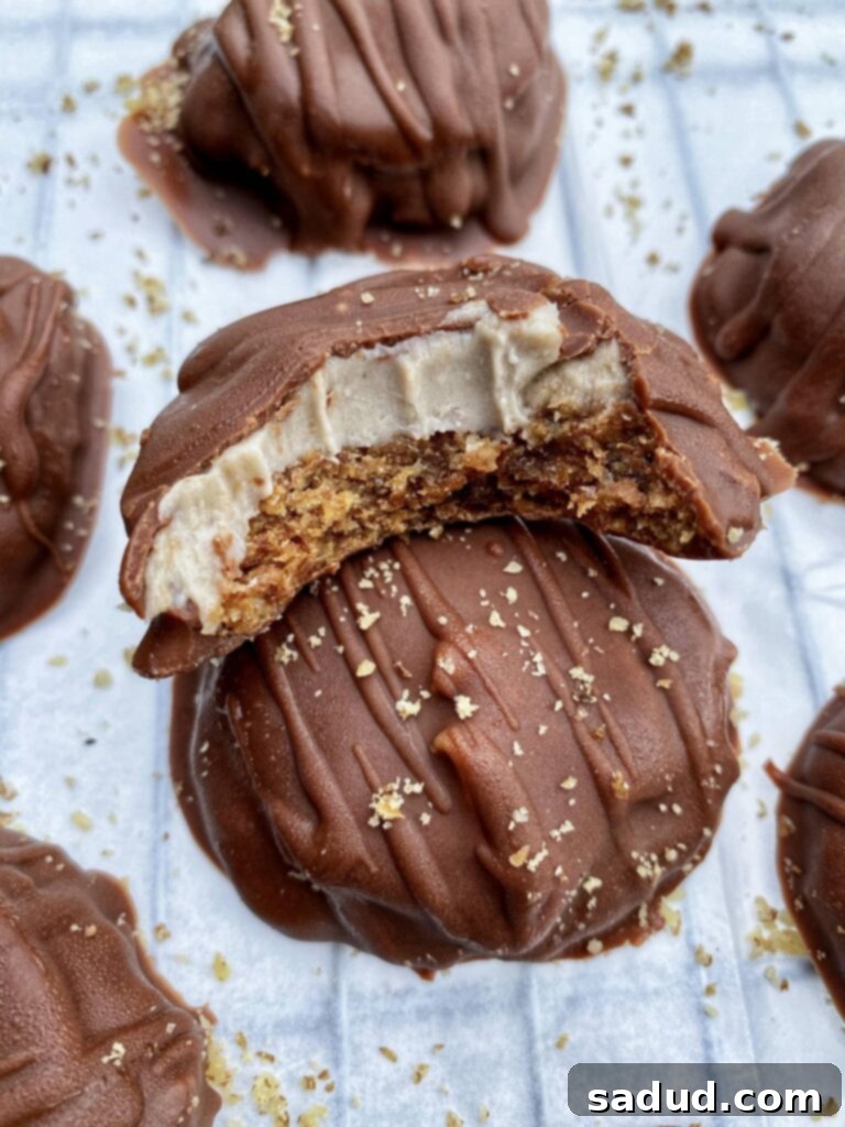 A perfectly baked banana caramel cookie with a bite taken out, revealing its rich, gooey caramel center.