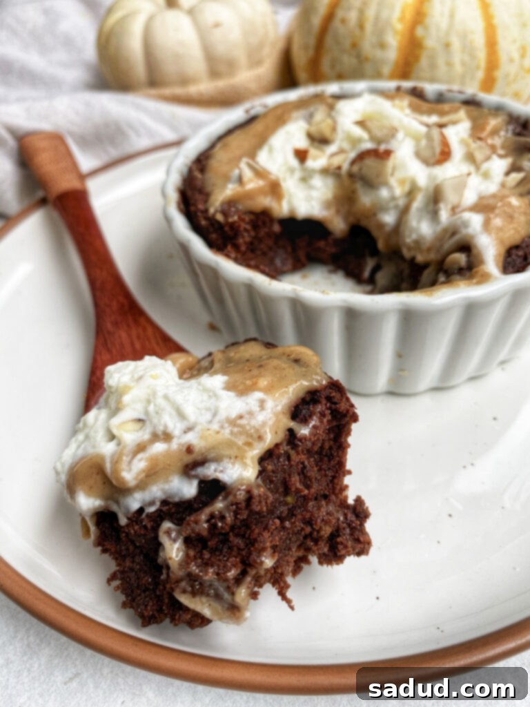 Healthy, vegan, gluten-free brownie mug cake topped with caramel sauce.