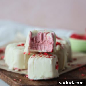 Frozen Strawberry Yogurt Bites with one taken out of the tray.