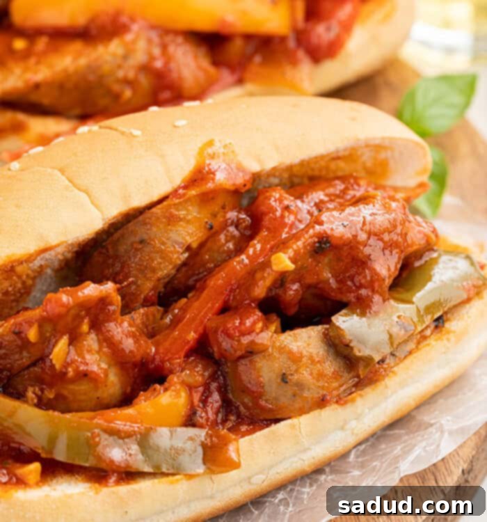 Two sandwiches filled with Instant Pot sausage and peppers