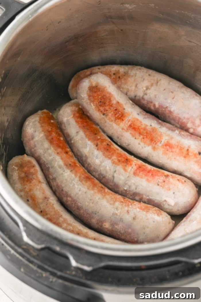 Browning Italian sausages in the Instant Pot with olive oil.