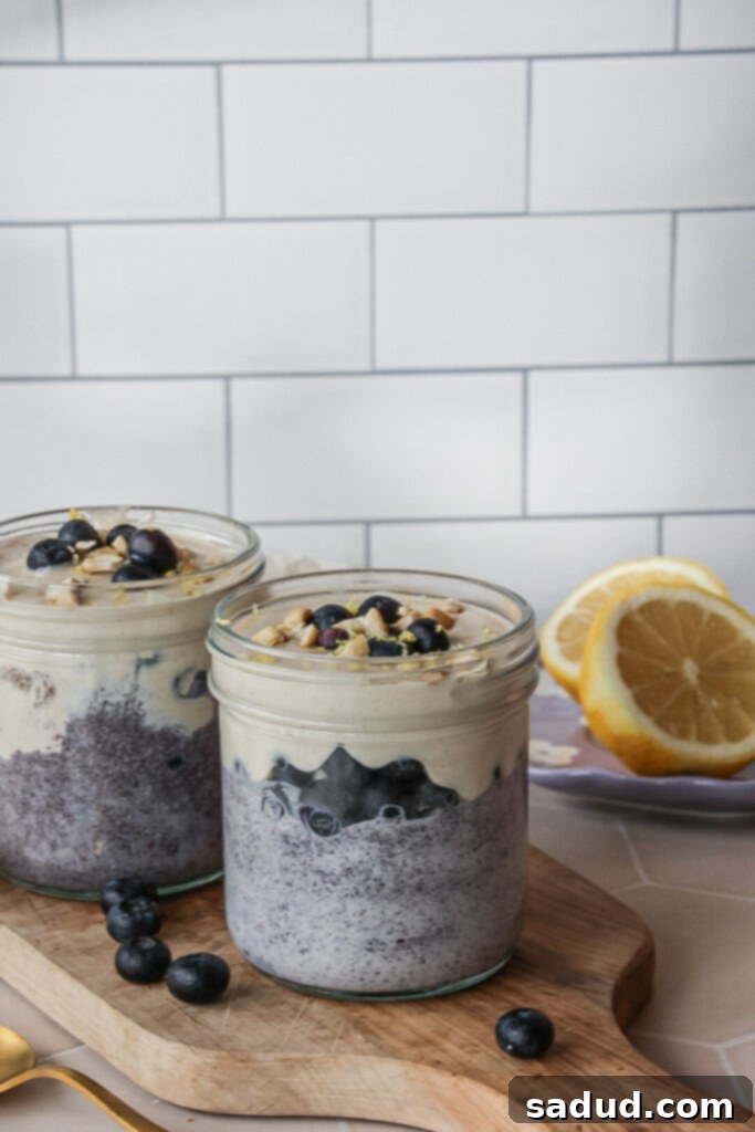 Two jars of lemon blueberry chia pudding with coconut milk, ready for meal prep.
