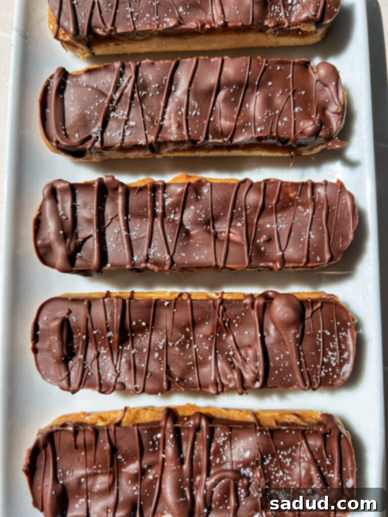 Incredible healthy, no-bake, vegan Snickers protein bars, naturally sweetened and packed with protein.