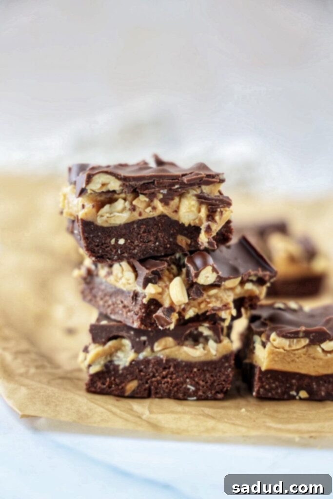 Healthy vegan, no-bake Snickers protein brownies, perfect for a high protein post-workout treat or snack.