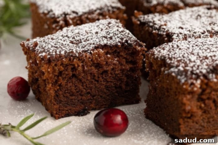 Several slices of perfectly baked gluten free gingerbread, showcasing its moist texture and rich color.
