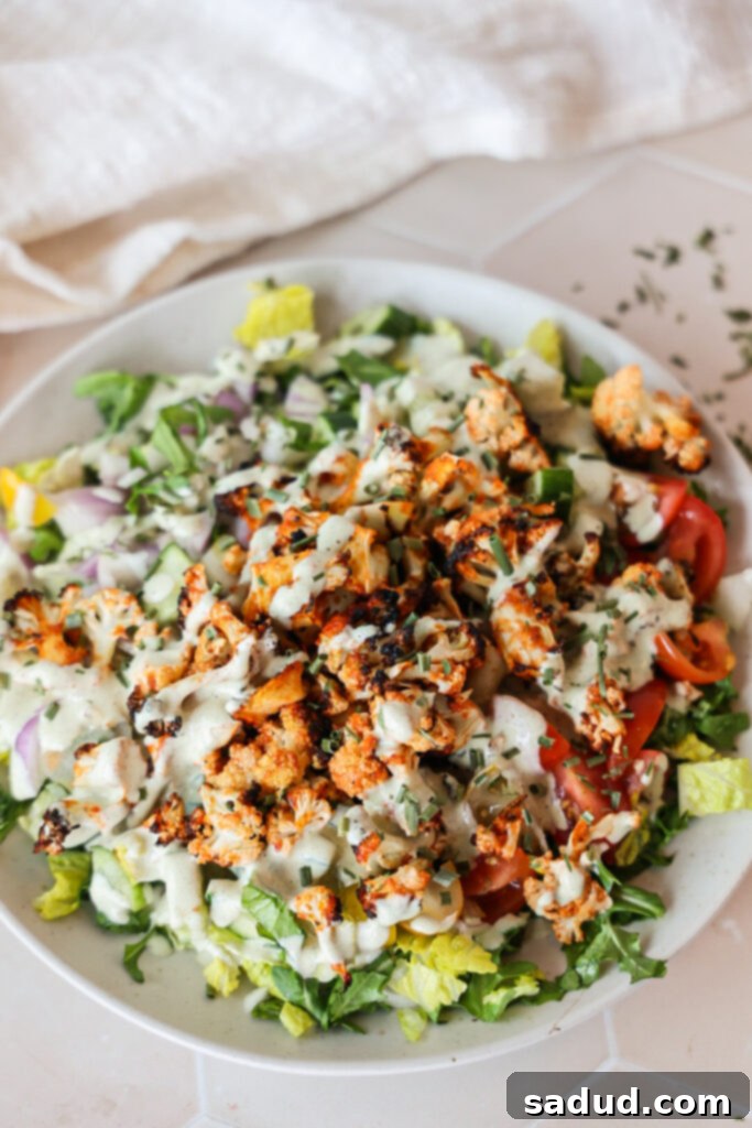 Crispy buffalo cauliflower chopped salad with creamy hemp seed ranch dressing.