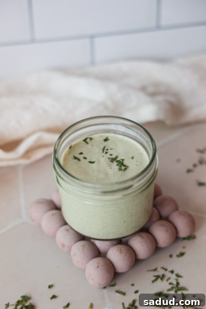 Creamy homemade hemp seed ranch dressing in a jar.