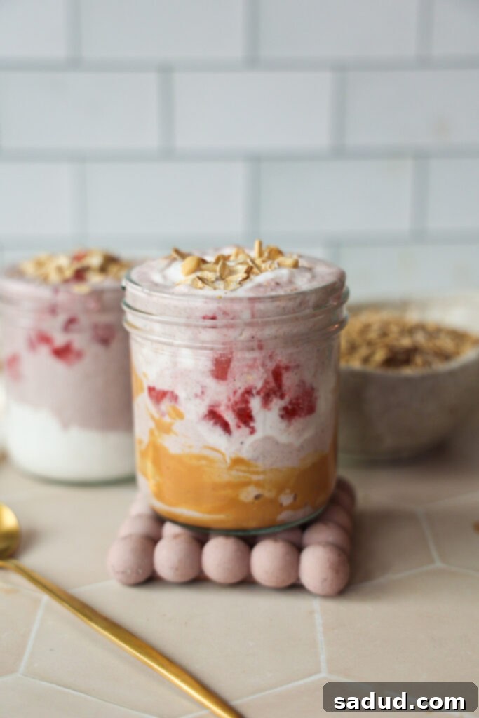 Two jars of strawberry chia overnight oats.