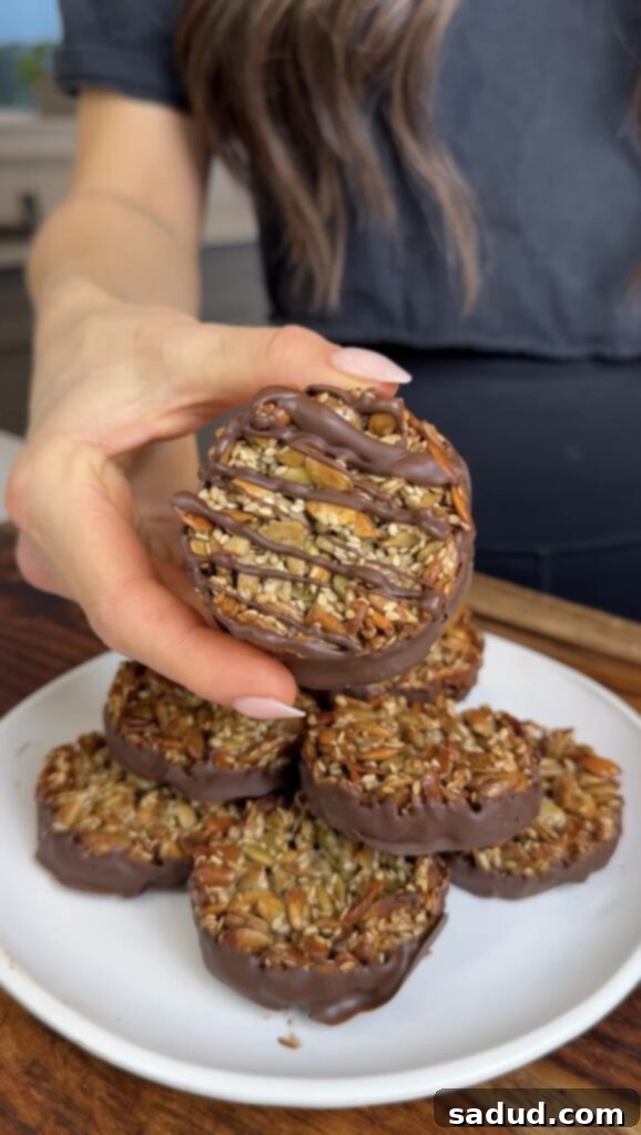 Super seed chocolate bars with pumpkin seeds and sunflower seeds. Vegan and nut free! A close-up showing the rich chocolate coating.
