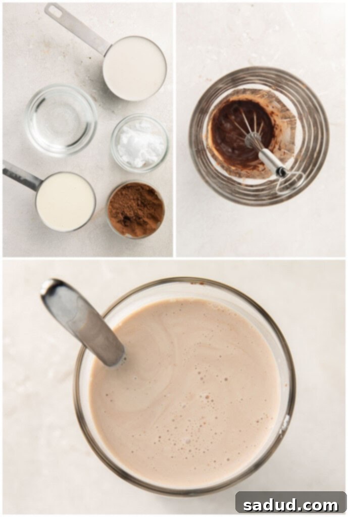 Close-up process photo showing cocoa powder being whisked with hot water to form a smooth slurry.