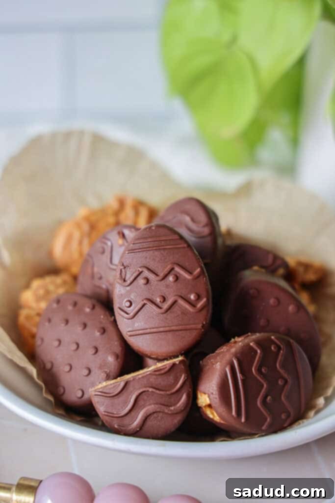 A bowl of vibrant peanut butter chocolate butterfinger Easter eggs, perfect for a healthy holiday treat.