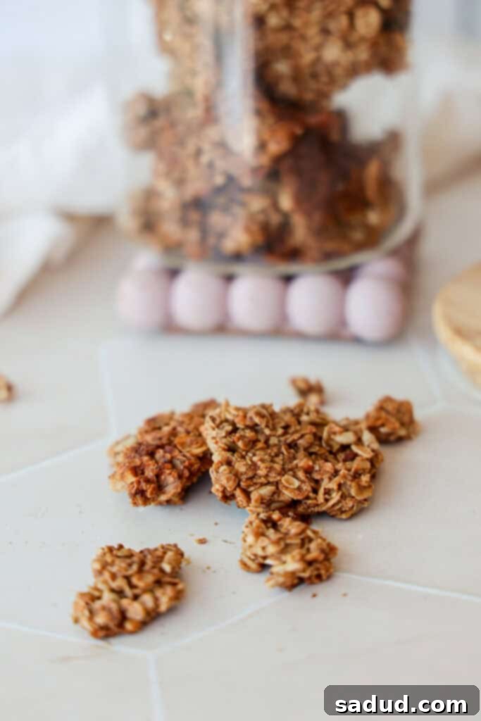 Healthy cinnamon toast crunch granola clusters in a jar.