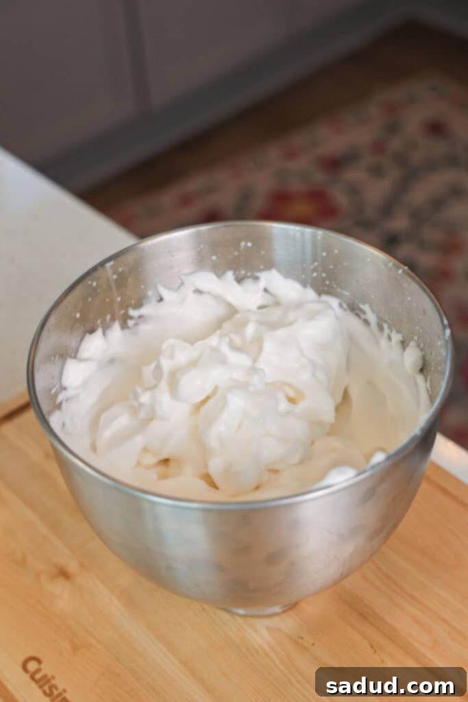 Preparing aquafaba for vegan mousse.