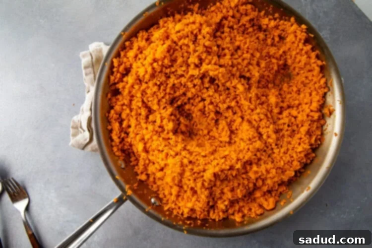 Silver saucepan with sweet potato rice