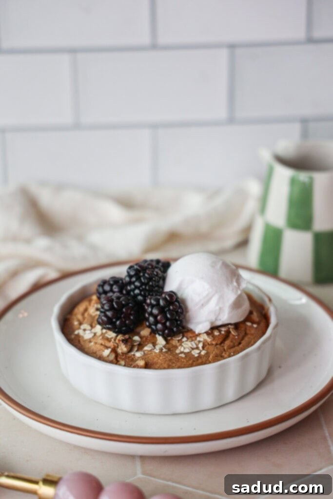 Delicious Protein Baked Oats without banana, topped with creamy yogurt and fresh berries for a healthy breakfast.