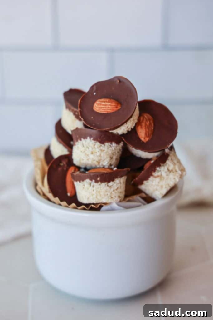 A close-up of a bowl filled with healthy homemade almond joy bites.