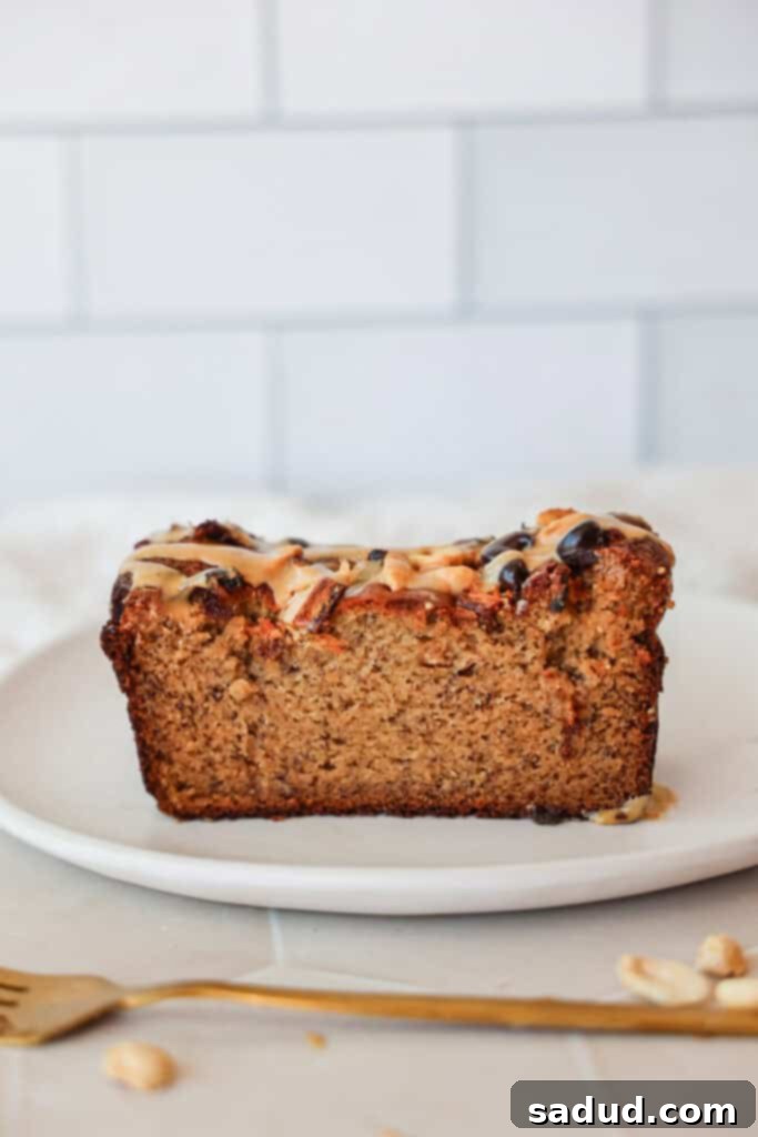 A perfectly baked loaf of one-bowl almond flour banana bread with chocolate chips, ready to be sliced.