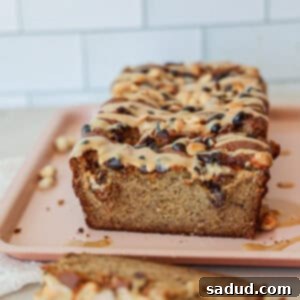 Almond flour banana bread with chocolate chips and peanut butter drizzle.