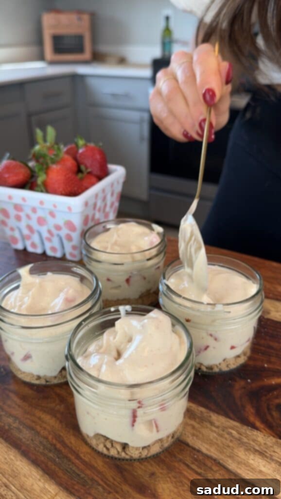 Step-by-step image of assembling strawberry yogurt parfaits in jars.