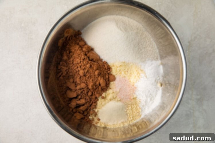 Dry ingredients for keto chocolate cake in a mixing bowl.