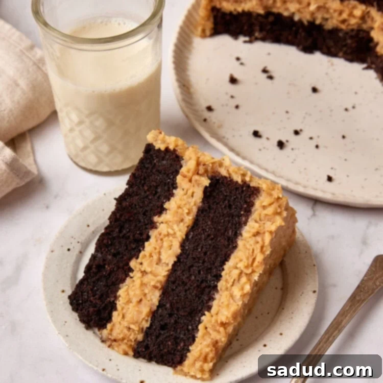 A beautifully sliced piece of Keto German Chocolate Cake on a plate, ready to be enjoyed.