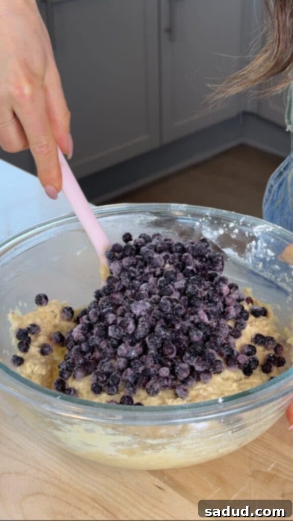 Mixing wet ingredients for gluten-free blueberry bread.